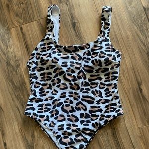 Cheetah print. Super cute!  One piece swimsuit, Large. Slightly cheeky.